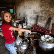 Girl cooking Burmese food in Falam, Myanmar (Burma)