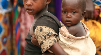 DR CONGO - NOV 2ND : Refugees cross from DR Congo into Uganda at