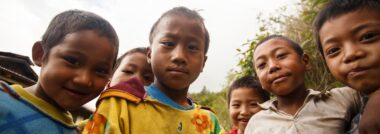 CHIN STATE, MYANMAR - JUNE 16 2015: Children play in the street of a village in the recently opened to foreigners area of Chin State - western Myanmar (Burma)