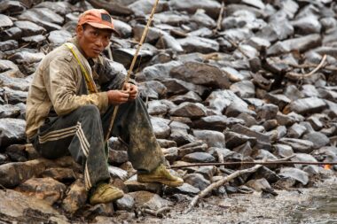 FALAM, MYANMAR - JUNE 17 2015: Fisherman at the start of the monsoon season in the recently opened to tourists Chin State region of Western Myanmar (Burma)