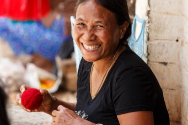 CHIN STATE, MYANMAR - JUNE 18 2015: Lady weaving with wool in the recently opened for tourists Chin State Mountainous Region, Myanmar (Burma)