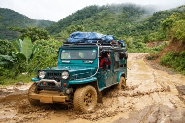 CHIN STATE, MYANMAR - JUNE 22 2015: Offroad Adventure on Dirt Road Leading Through Chin State Mountainous Region, Myanmar (Burma)